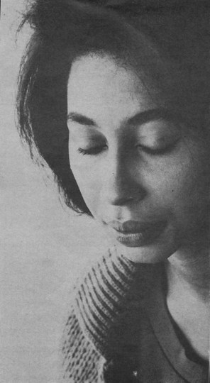 woman's face from upper right, praying?